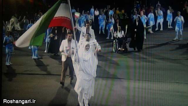 رژه کاروان پارالمپیک ایران با پرچمداری خانوم عشرت کردستانی با لباس احرام
